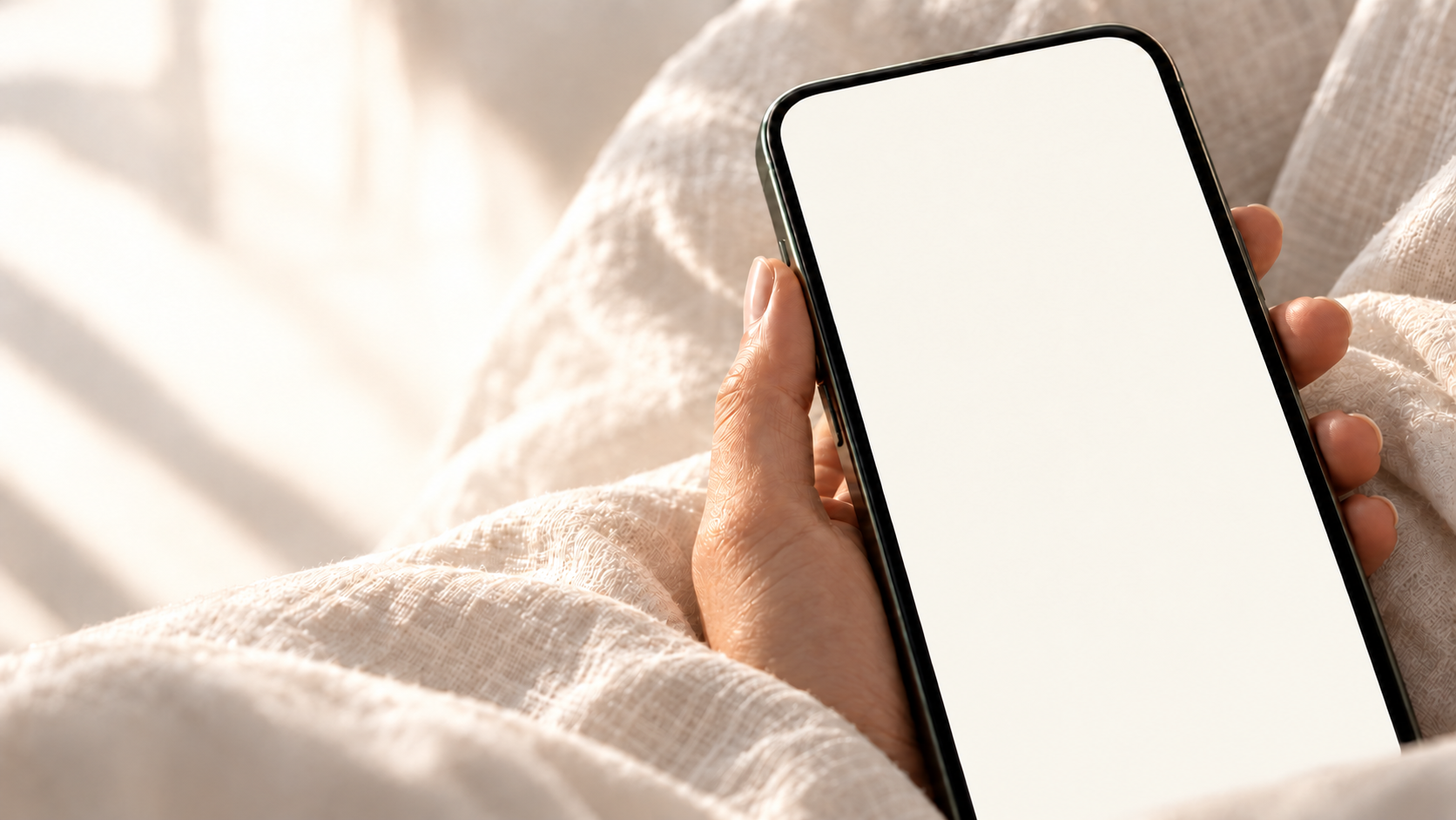 A personal check-in moment: a hand holding EndoAI in soft morning light